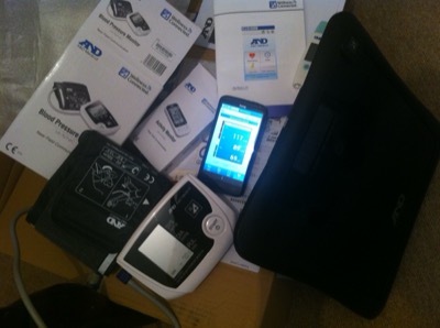 Home health monitoring devices laid out on a desk